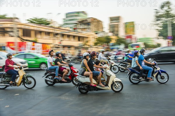 Scooter drivers in heavy traffic