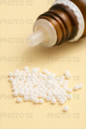 Globules in a pile with bottle
