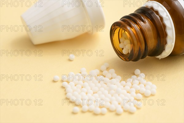 Globules in a pile with bottle
