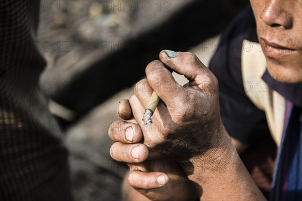 Man smoking cigarillo