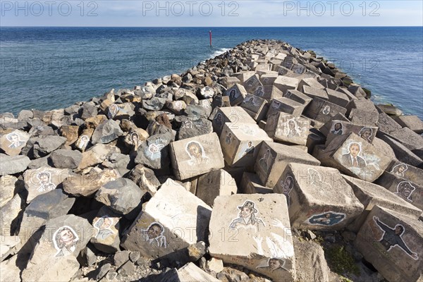Pictures of famous musicians painted on stones at the Auditorio de Tenerife