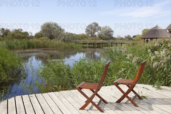 Two chairs on viewing platform at the lagoon