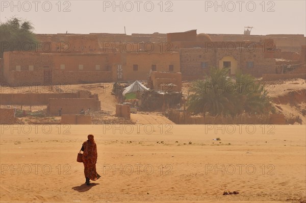 Woman in a dry riverbed