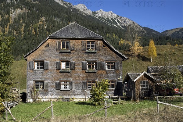 Old Allgau house covered with wooden shingles