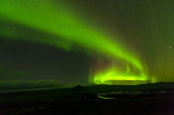 Northern lights over river delta