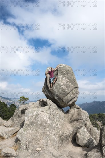 Young man standing in a rock formation