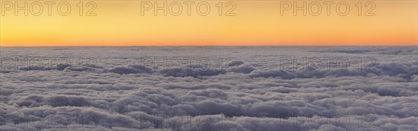 Sunset above the clouds