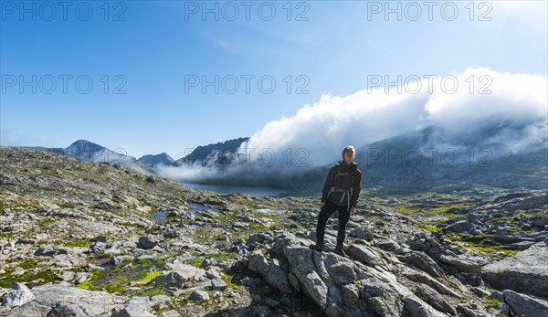 Hiker standing on rock