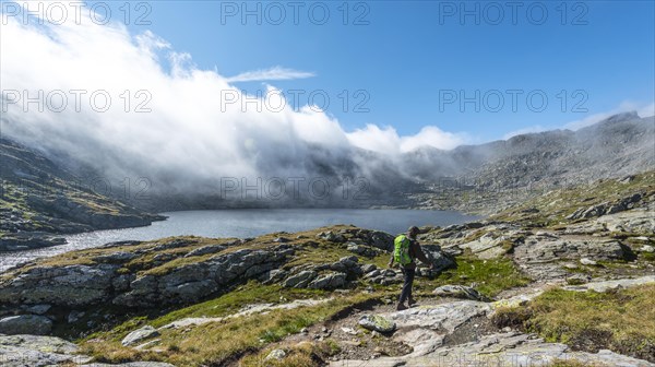 Hiker standing on rock
