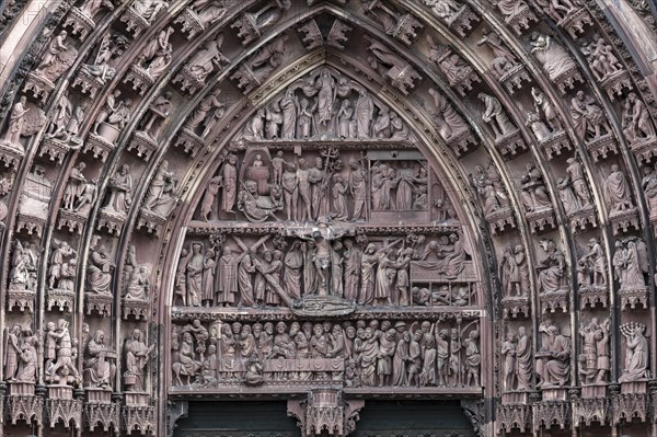 Rich sculptural decoration in the tympanum of the portal at the Strasbourg Cathedral