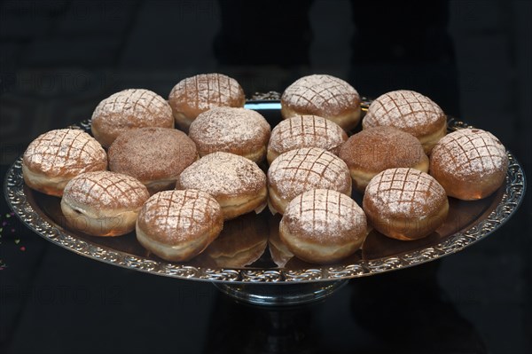 Berliner or doughnuts on a silver platter
