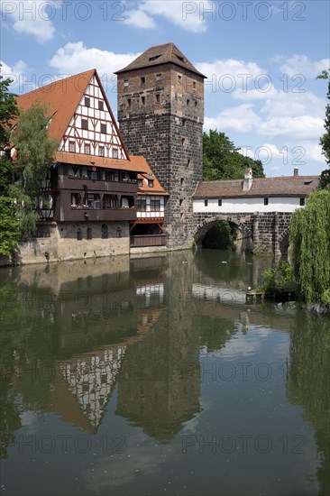 Old timbered houses and hanging tower and bridge