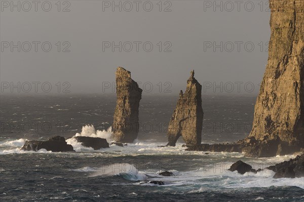 Sea stacks Risin og Kellingin in the evening light