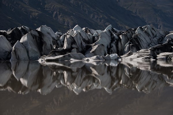 Glacier tongue reflected in the water