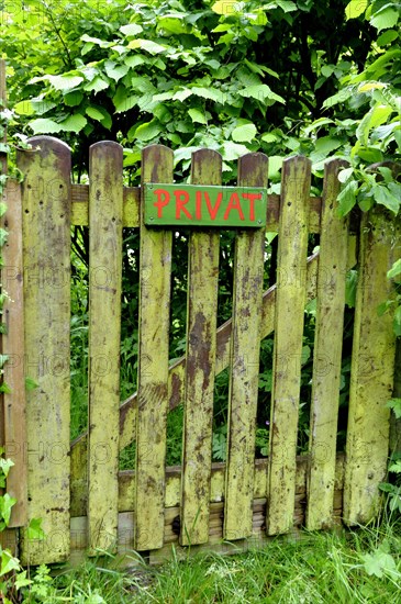 Garden gate with a sign privat