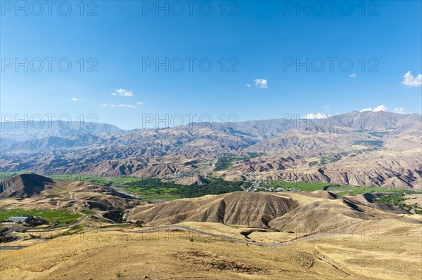 View over Rajaei Dasht village in green valley