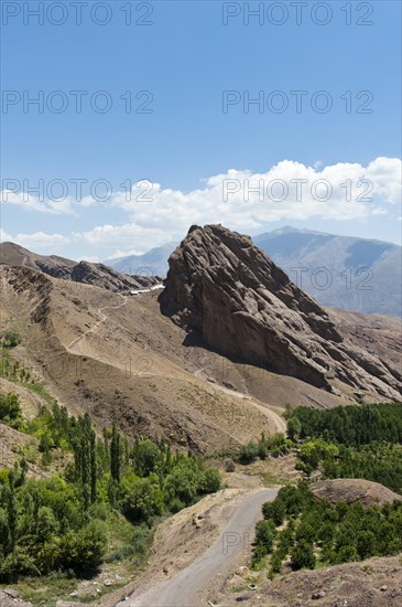 Steep towering rock and ruins of Alamut mountain fortress