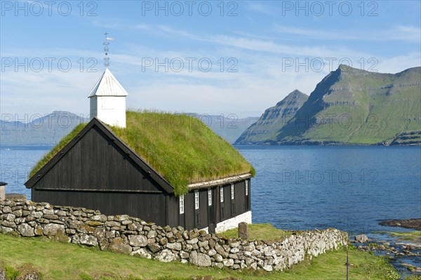 Old Faroese wooden church with a grass roof
