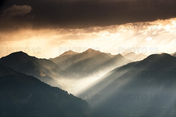 Landscape with sunbeams on the Diedamskopf with view towards Kanisfluh and Damuls