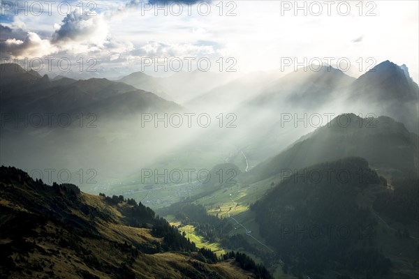 Landscape with sunbeams on the Diedamskopf with view towards Kanisfluh and Damuls