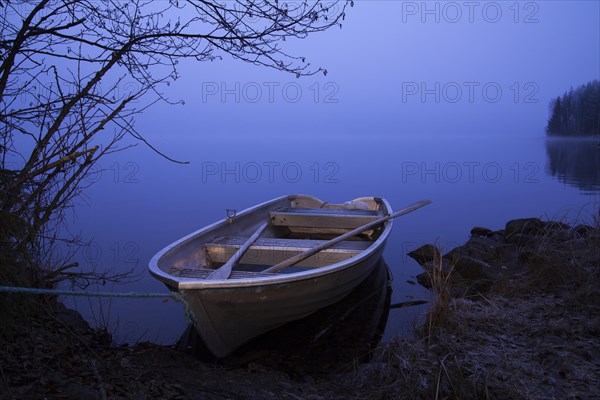 Rowboat on the bank of the lake