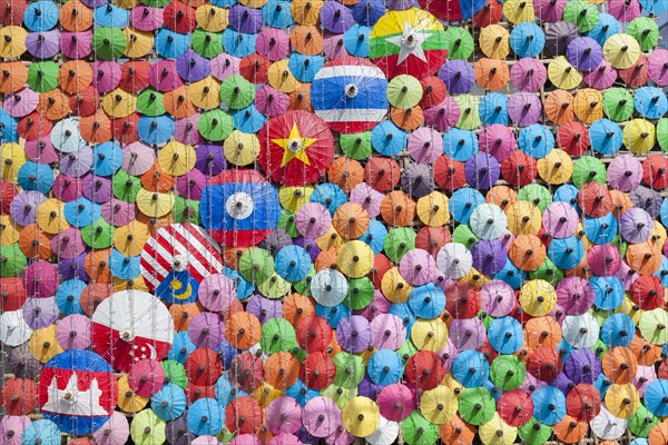 Many colourful umbrellas suspended in mid-air