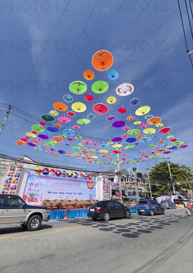 Many colourful umbrellas suspended in mid-air