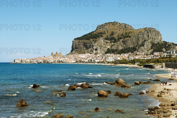 Beach and limestone cliff Rocca di Cefalu