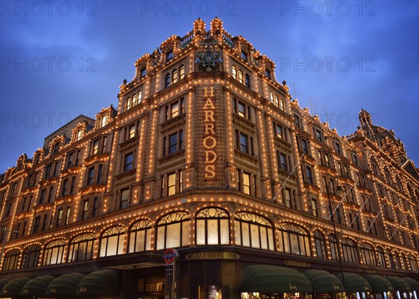 Illuminated Harrods department store in the evening