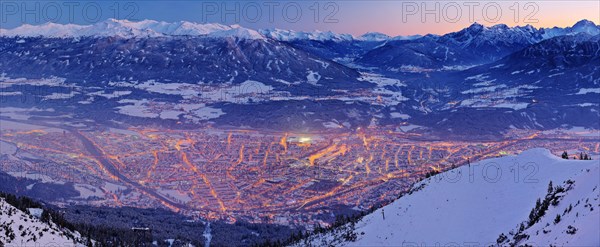 Innsbruck covered in snow at dusk