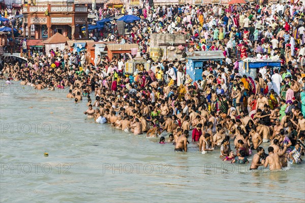 Masses of pilgrims are gathering for bathing at Harki Pauri Ghat at the holy river Ganges