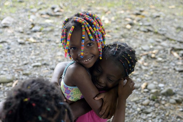 Two girls hugging each other