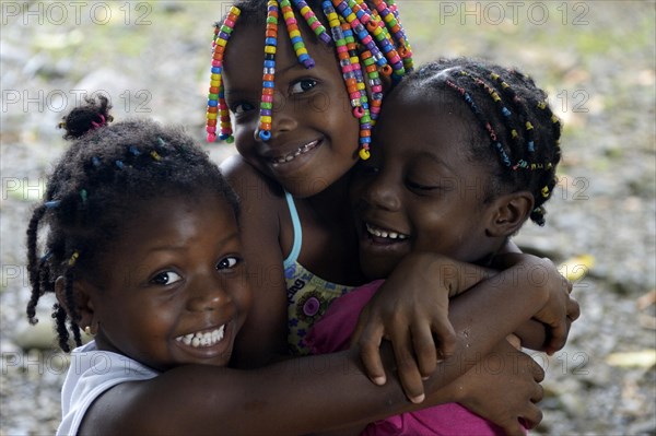 Three girls hugging each other
