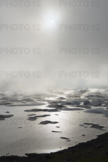 Glacial lake in fog
