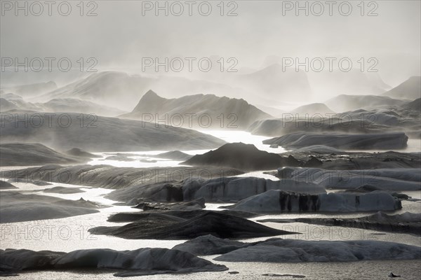Glacial lake and glacier in fog
