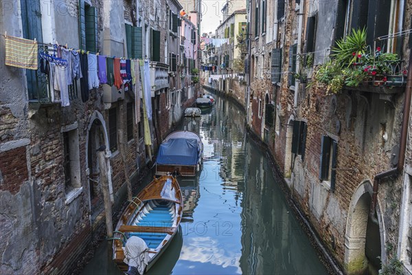 Canal with boats moored