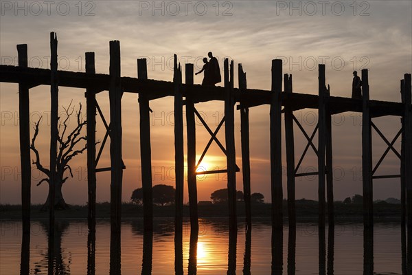 Two monks walking on the U Bein Bridge