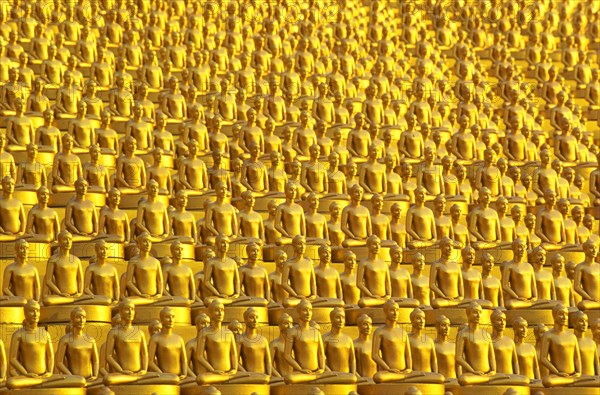 Small golden Dhammakaya Buddha statues at the Chedi