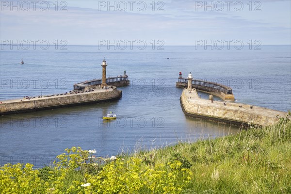 Entrance to Whitby Harbour with lighthouses