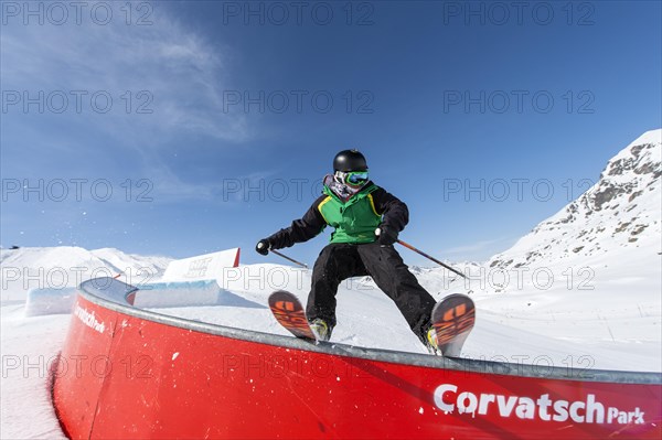 Skier on rail in the park