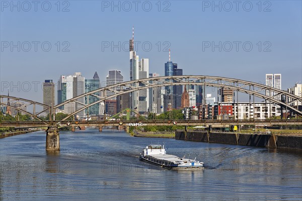 Freighter on River Main beneath Deutschherrnbrucke and skyline