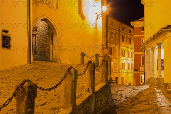 Alley with archway at night