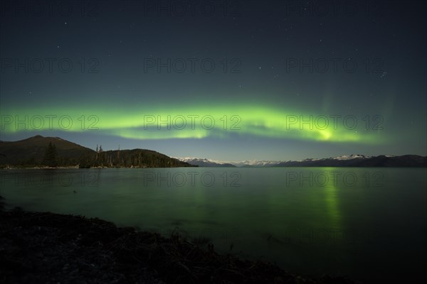 Aurora borealis and moonlight over Prince William Sound
