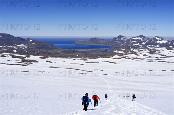 Hikers trekking in snow