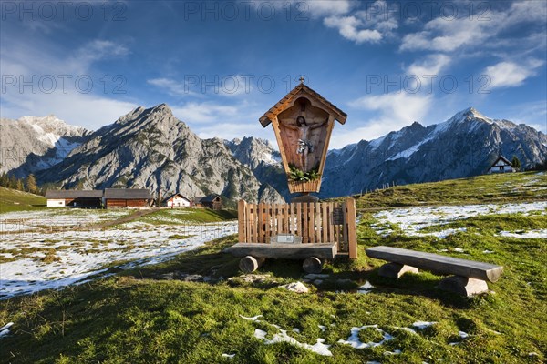 Way-side cross in front of Walder Alm and Karwendel Mountains