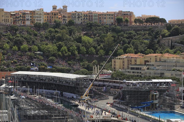 Pool and grandstands in front of Monaco's historic centre