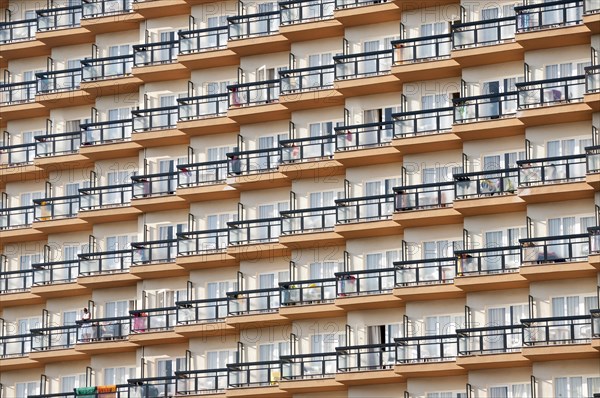 Rows of balconies on the facade of a large hotel complex in Torremolinos