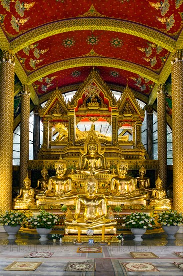 Golden Buddha statues in the temple district Wat Phra That Nong Bua