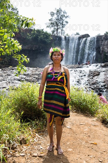 Phnong woman posing for tourists at the Bousra waterfall