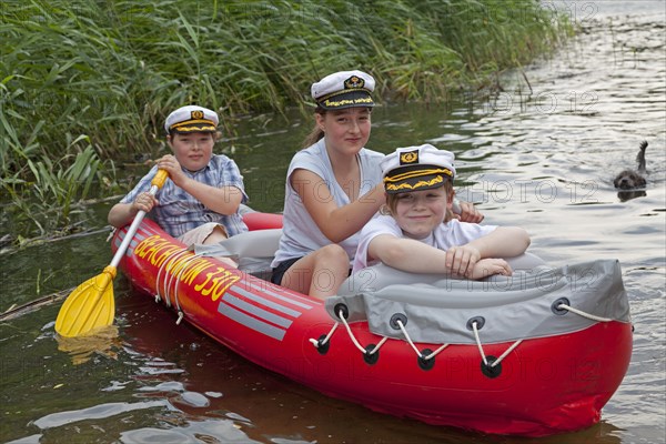 Children in a rubber dinghy